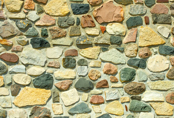 Close up image of a rustic stone and mortar wall.