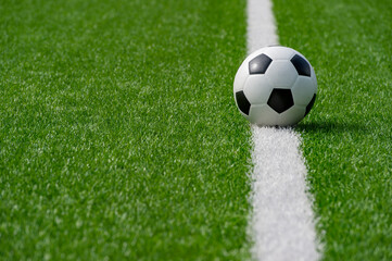 Black and white soccer ball in the field. Team sport concept. Workout online theme. © Augustas Cetkauskas