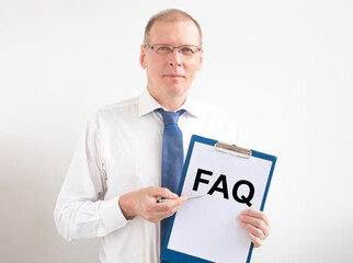 FAQ frequently asked questions text on paper board