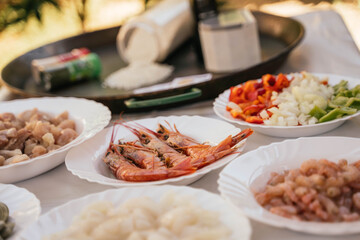 Prawns and garnish to prepare a typical seafood paella from Spain