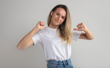 This is me. Portrait of happy self-confident woman pointing at herself and smiling joyfully,...
