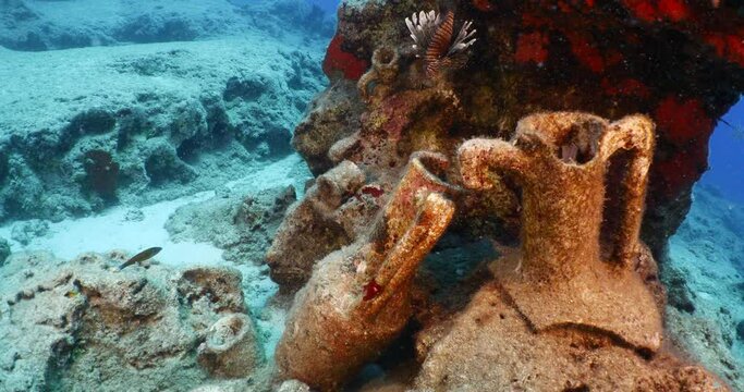lionfish scenery underwater around old ancient historical amphoras mediterranean sea scenery of kas turkey
