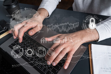 Man using computer. Hands typing laptop. Double exposure with business icons map hologram. Close up. Investment concept.