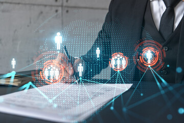 Businessman in suit signs contract. Double exposure with social media and planet hologram. Man...
