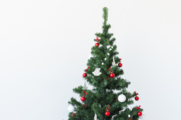 Holidays and celebration concept - Decorated Christmas tree on white background with copy space.