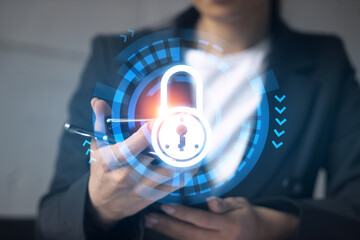 Businesswoman using smart phone in office. Lock icon hologram. Data protection concept. Double exposure.