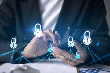 Businesswoman using smart phone in office. Lock icon hologram. Data protection concept. Double...