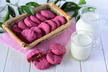 Obraz na płótnie Canvas Beetroot cookies in a wicker basket on a white background