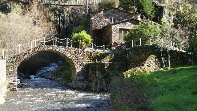 stone shale bridge from small village foz de &eacute;gua Piod&atilde;o Portugal slow motion 4k