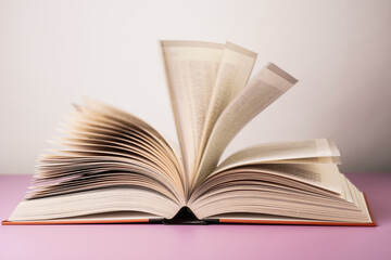 Close-up of open book on the table.