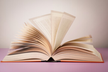 Close-up of open book on the table.