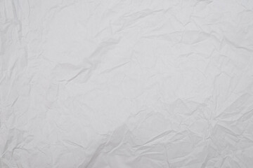 Crumpled white paper background.