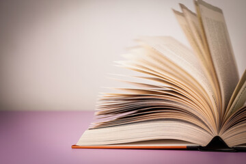 Close-up of open book on the table.