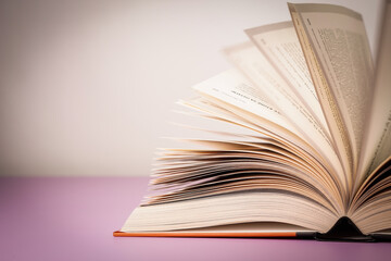 Close-up of open book on the table.
