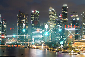 Fototapeta na wymiar Glowing Social media icons on night panoramic city view of Singapore, Asia. The concept of networking and establishing new connections between people and businesses. Double exposure.