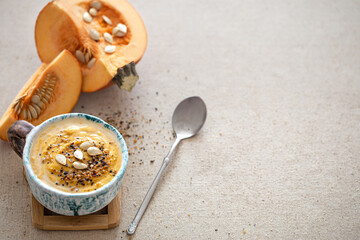 Delicious composition with pumpkin soup, top view.