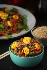 Japchae, a sweet and savory dish of stir-fried glass noodles, Korean cuisine