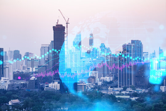 Forex and stock market chart hologram over panorama city view of Bangkok, the financial center in Asia. The concept of international trading. Double exposure.