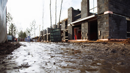 Fototapeta premium building houses on a dirty construction site