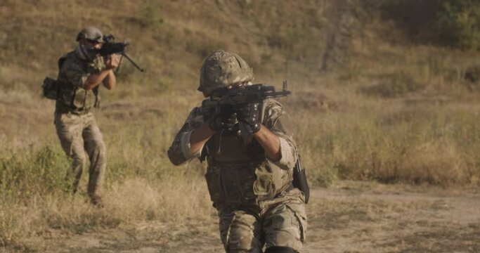 Anonymous military man aiming rifle