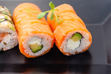 Sushi rolls philadelphia with salmon, cream cheese, avocado