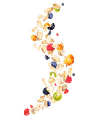 Oat flakes with wild berries in the air isolated on a white background