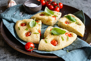 Sliced Focaccia bread with tomatoes and basil