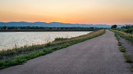 dusk over bike trail with Rocky Mountains in background, one of numerous recreational trails in Fort Collins, Colorado