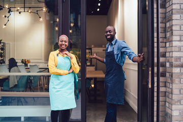 Black waiters inviting customers to cafe