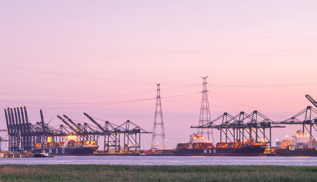 Large container vessel is being towed into the Deurganck dock of the Port of Antwerp