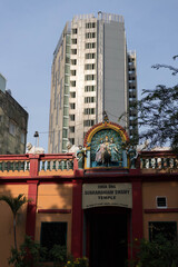 Ho Chi Minh City, Vietnam - March 9, 2020: Sri Thenday Yuttha Pani Yutthapani Hindu temple in Ton That Thiep Street with a tower of Saigon Centre in the background.