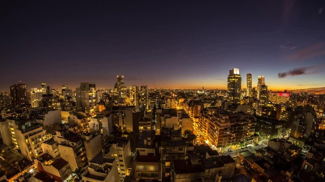 Night time-lapse view on the skyline of the city from a balcony of a high rise apartment in Buenos Aires, Argentina.