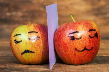 abstract image of couple hide your human emotions from others. different emotions from happy smile...
