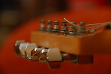 Fototapeta na wymiar close up of the tuning pegs of an acoustic guitar
