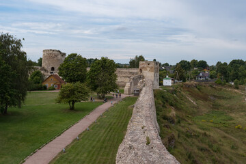 Fototapeta na wymiar Talavskaya tower and Vyshka Tower with wall in medieval Izborsk fortress. Izborsk, Pskov region, Russia.