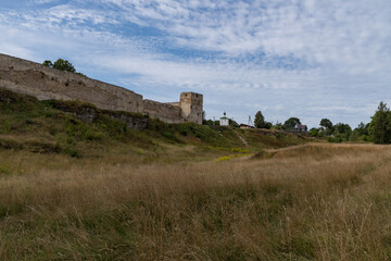 Fototapeta na wymiar Medieval Izborsk fortress wall, Talavskaya tower and Chapel of the Korsun Icon of the Mother of God. Izborsk, Pskov region, Russia.