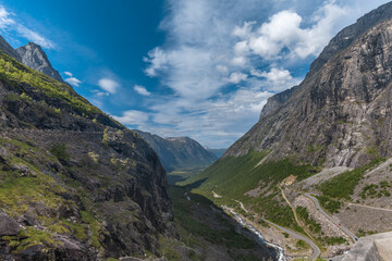 Naklejka premium The thrilling Trollstigen ascent through a serpentine mountain road and pass in Rauma, Møre og Romsdal, Norway..With steep incline of 10% and eleven hairpin bends up a steep mountainside.