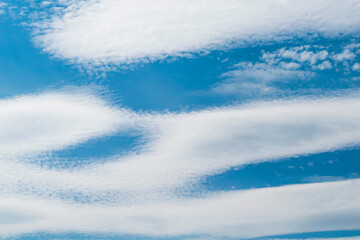 Fototapeta premium White clouds in a blue Sunny sky