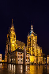 Fototapeta na wymiar Night view of the Metropolitan Cathedral of Saints Vitus (St. Vitus Cathedral) with light illumination located in Prague Castle, Czech Republic
