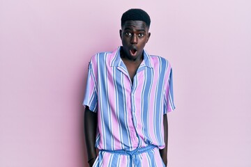 Young african american man wearing casual clothes afraid and shocked with surprise and amazed expression, fear and excited face.