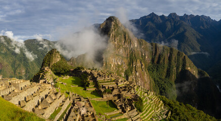 Panorama landscape of amazing sunrise in moutains and historical ancient inca civilization of Machu Picchu mountain in Aguas calientes, cusco, peru