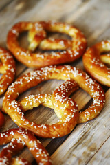 Fresh homemade pretzels on a wooden surface. Oktoberfest symbol.