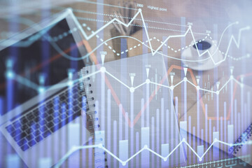 Double exposure of businesswoman hands typing on computer and forex chart hologram drawing. Financial analysis concept.