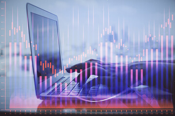 Double exposure of woman hands typing on computer and forex chart hologram drawing. Stock market analysis concept.