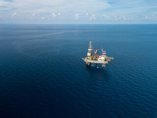 Aerial view from a drone of an offshore jack up rig at the offshore location during day time