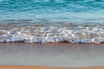 Soft Wave Of Blue Ocean On Sandy Beach. Background. Selective focus