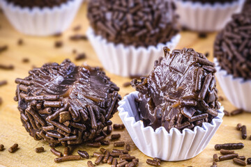 Brazilian Brigadeiro candy (or negrinho), a Brazilian chocolate candy, with a bite mark.