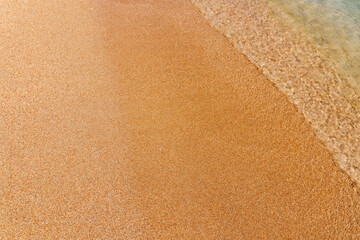 Soft Wave Of Blue Ocean On Sandy Beach. Background. Selective focus