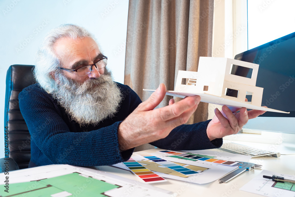 Poster an elderly architect considers the layout of the future house. a construction engineer is developing