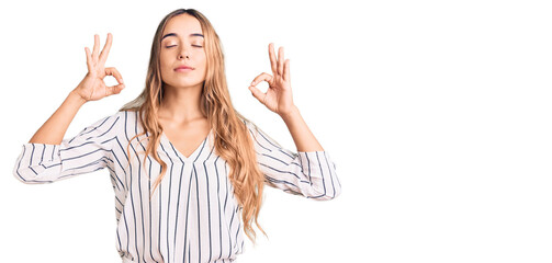 Young beautiful blonde woman wearing casual clothes relax and smiling with eyes closed doing meditation gesture with fingers. yoga concept.